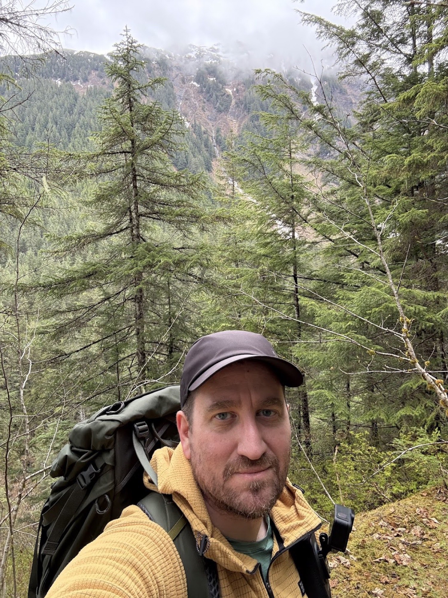Guide on the East Glacier Trail with backpack